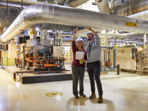 woman and man inspecting equipment
