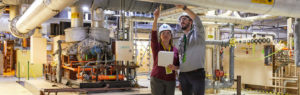 woman and man inspecting equipment