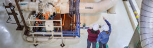 two women inspecting equipment