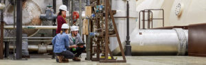 woman man and woman inspecting equipment
