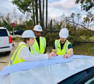 ENERCON team members discussing patrol plans. Pictured left to right: Marina Sanchez, TJ Hedrington, and Trent Richardi