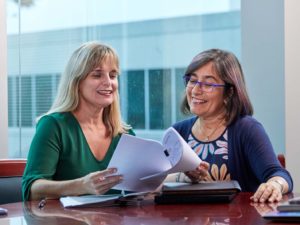 2 Employees reviewing report