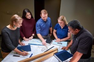 Group looking at project plans