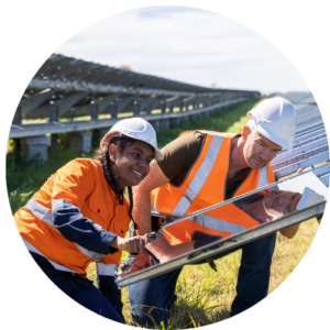 Two people working with solar panels.