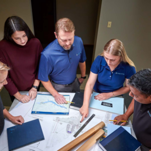 ENERCON engineers looking at blueprints