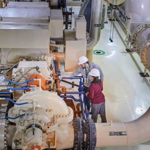 Workers in hard hats inside nuclear power plant
